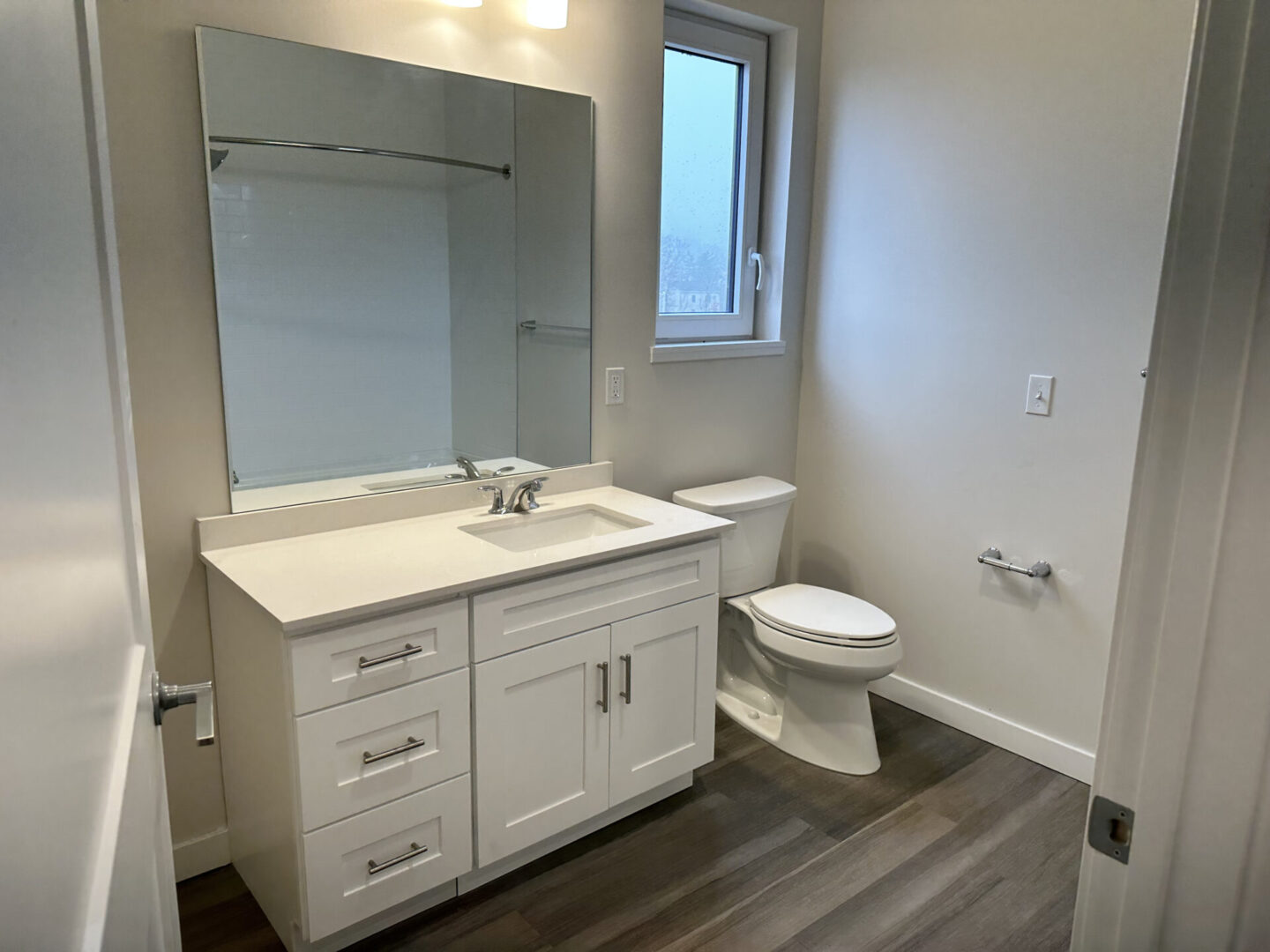 bathroom with white counter and toilet