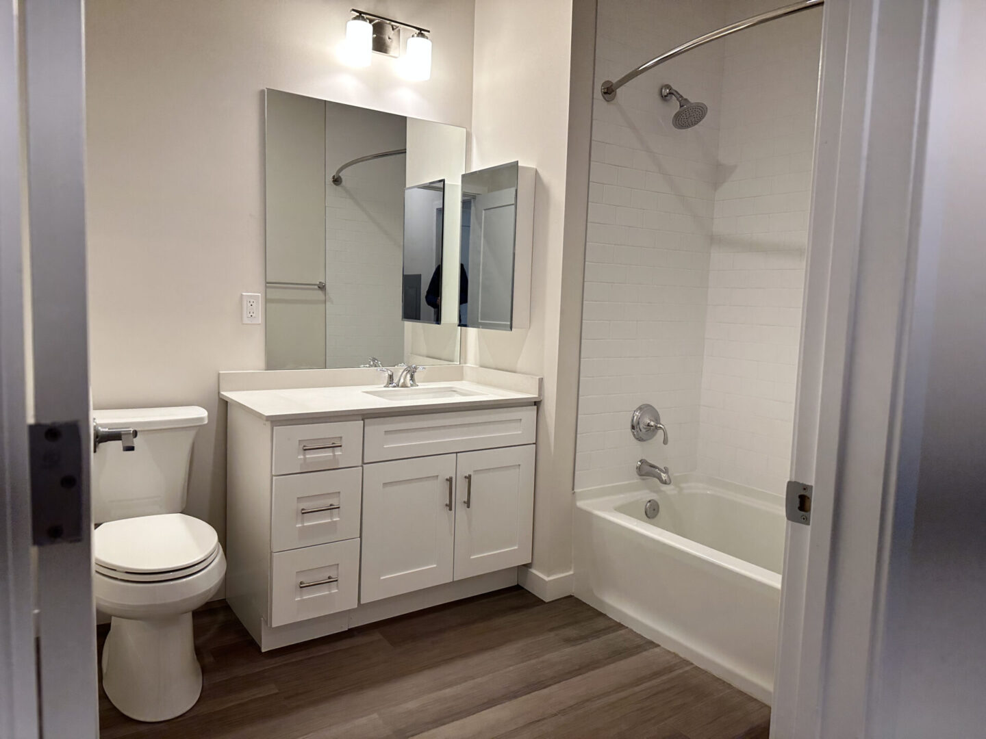 another bathroom with shower and bathtub