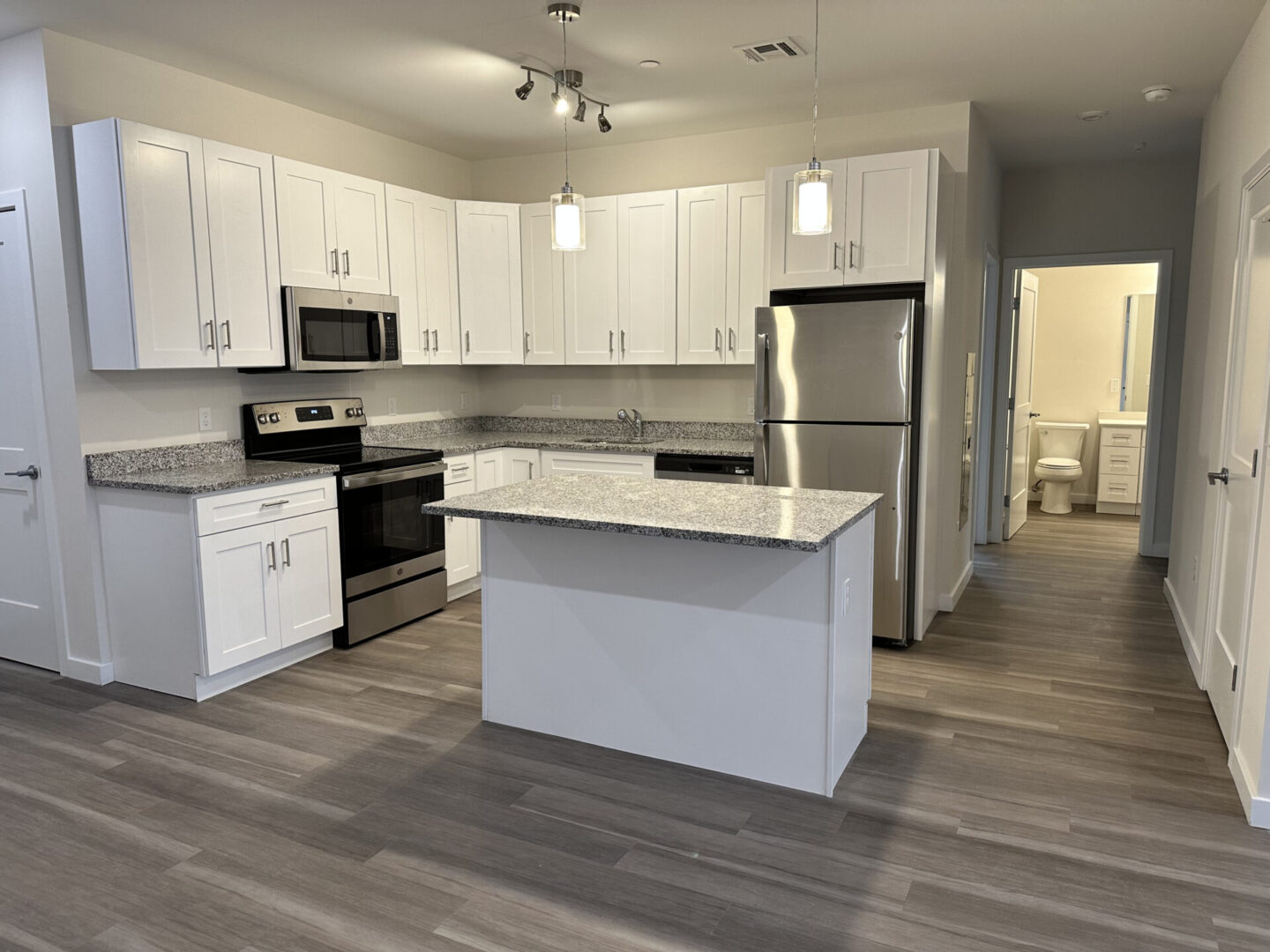 kitchen with hallway and entrance to a bathroom